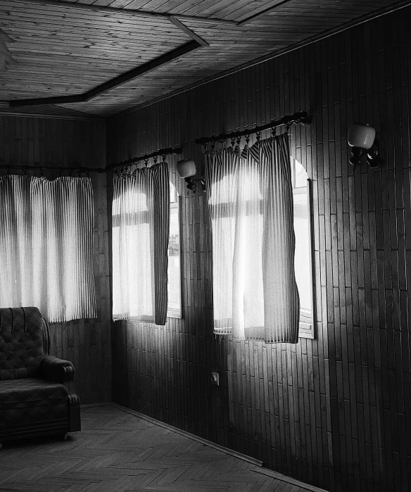 the interior is black and white and shows a couch