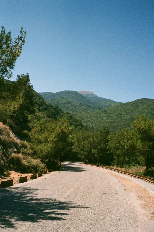 a road with mountains in the distance