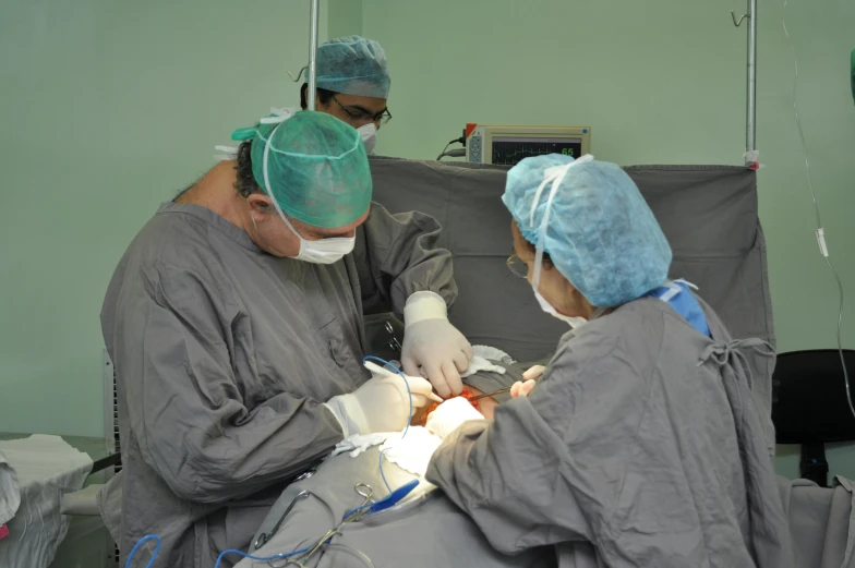 a dental technician performing soing in a dental procedure on a patient