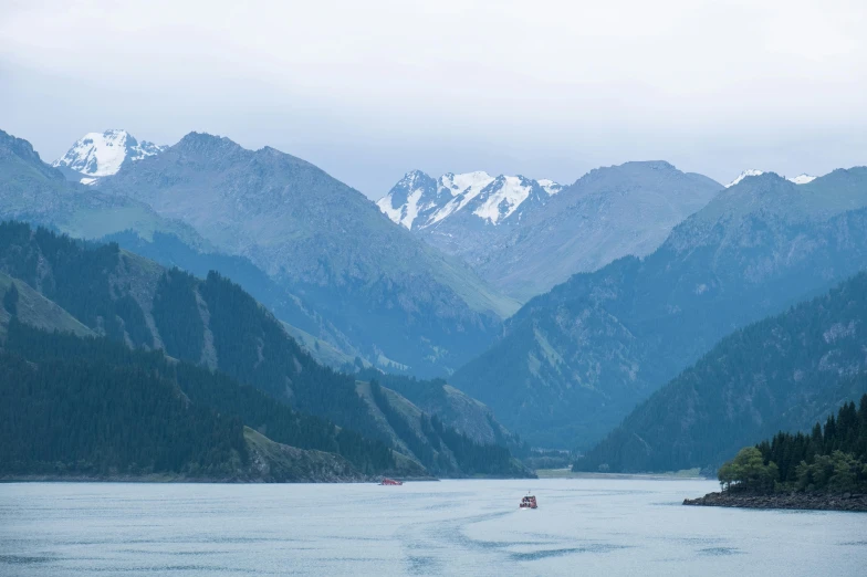 a body of water with mountains around it