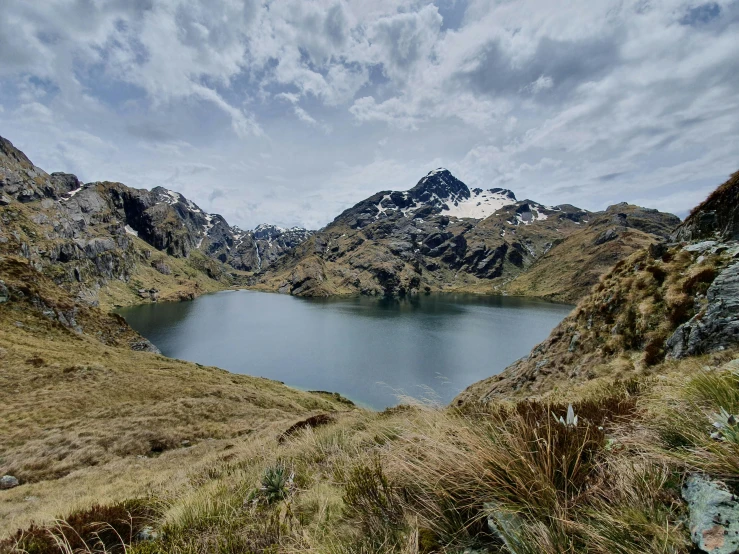 this is a lake in a grassy field