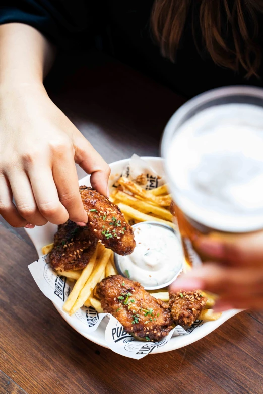 a close up of a plate of food with french fries