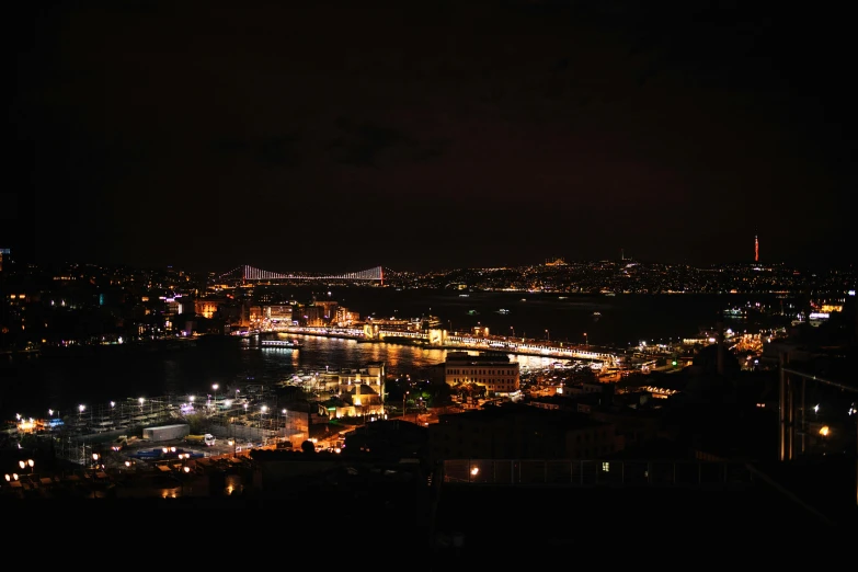 a city at night lit up with buildings and lights