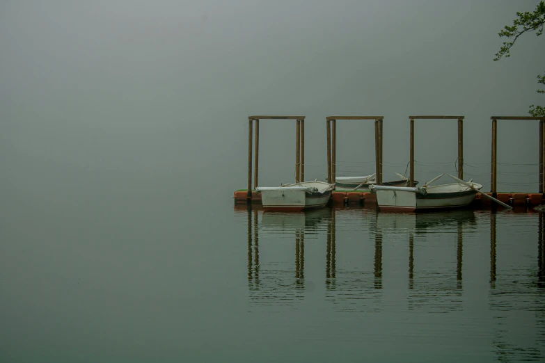 the boat is tied to the dock on the water