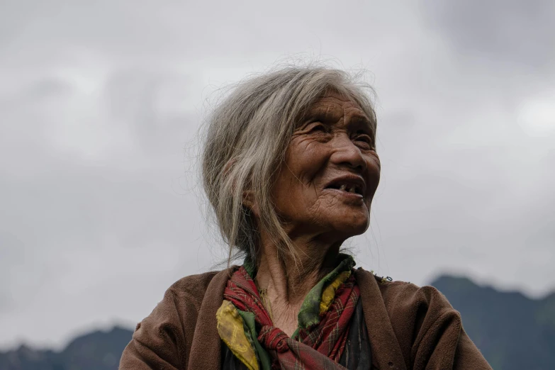 an old woman with blonde hair smiles for the camera