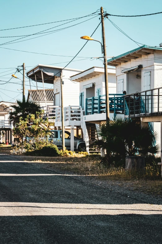 this is a row of white townhouses along the street