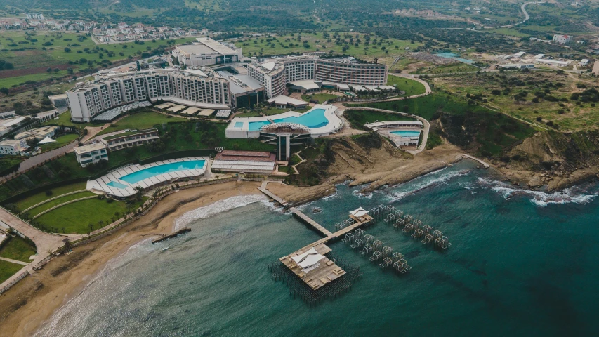 an aerial view of a resort with a swimming pool