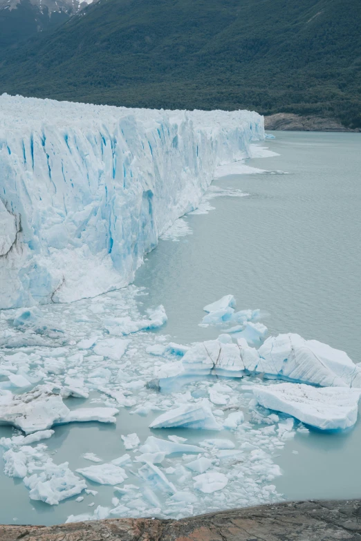 an iceberg in the middle of a glacier lake