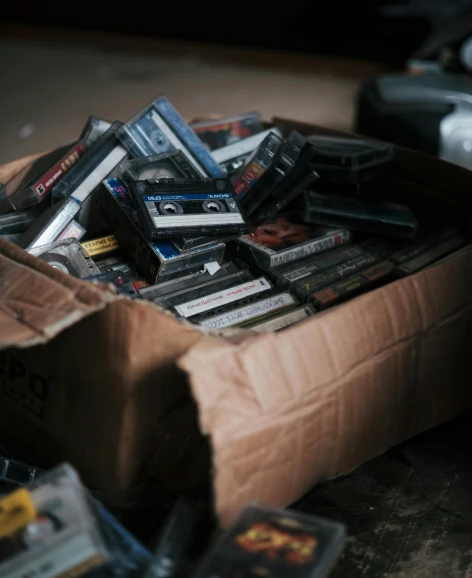 a box full of cassettes on top of a table