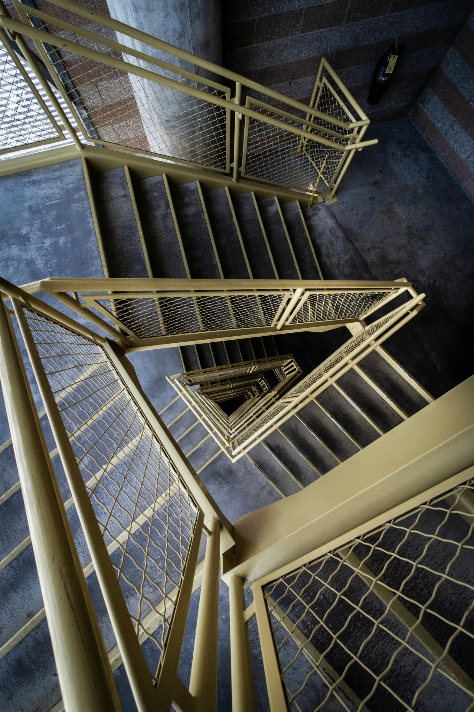 three abstract metal structures are shown in an angled view