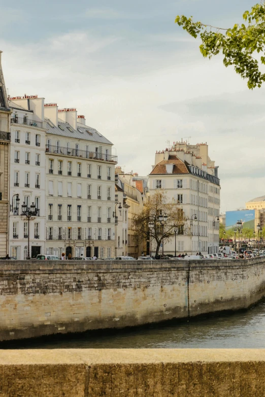 a river runs past old buildings near one another