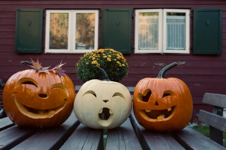 a couple of pumpkins sitting on top of a table