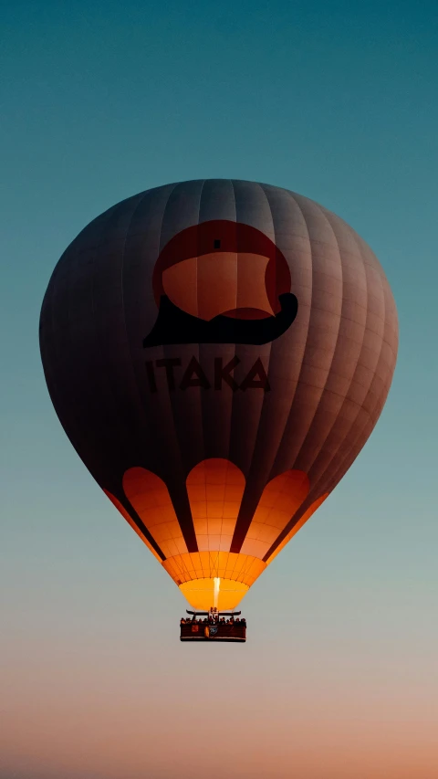 large balloon in the sky with a picture on it