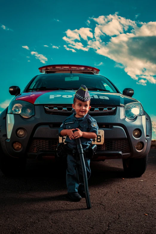 a  in uniform stands next to a car