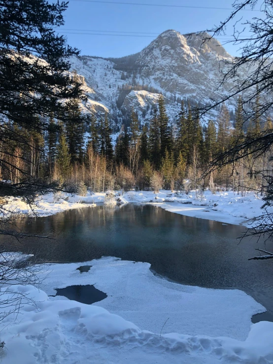 a river with some snow around it