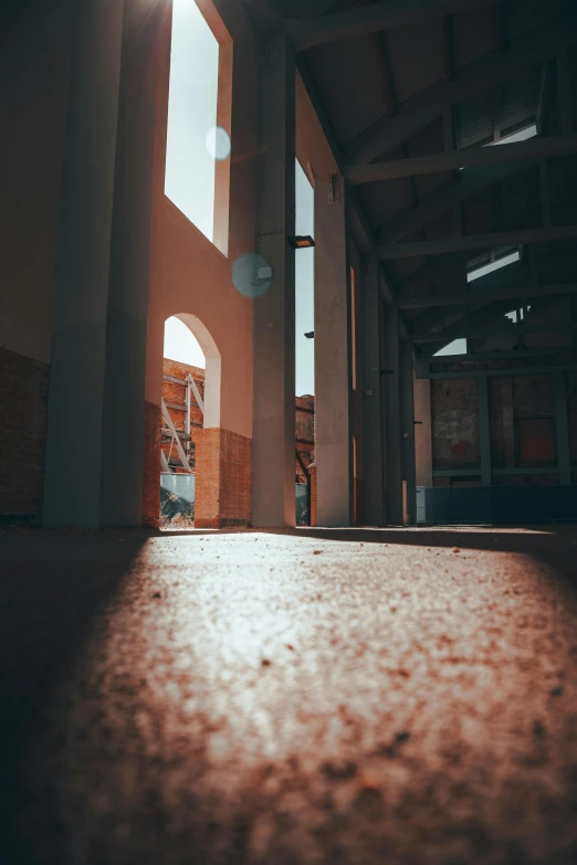 a hallway with sunlight shining in from behind