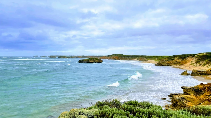 a beautiful beach scene, with the tide in the ocean