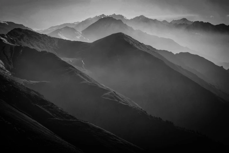 black and white po of mountains in the rain