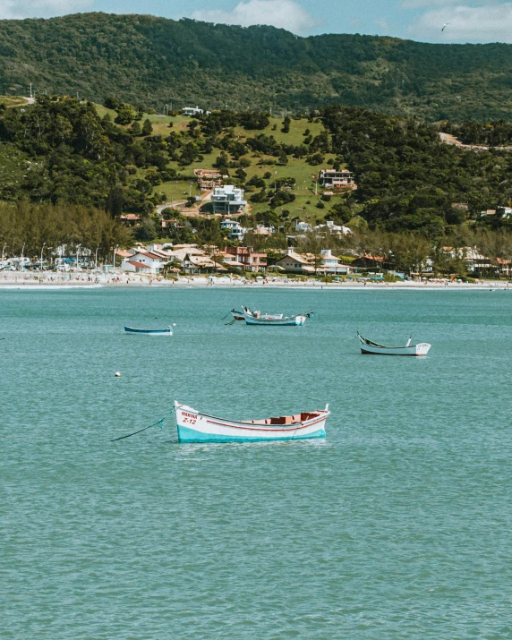 a number of small boats in a body of water