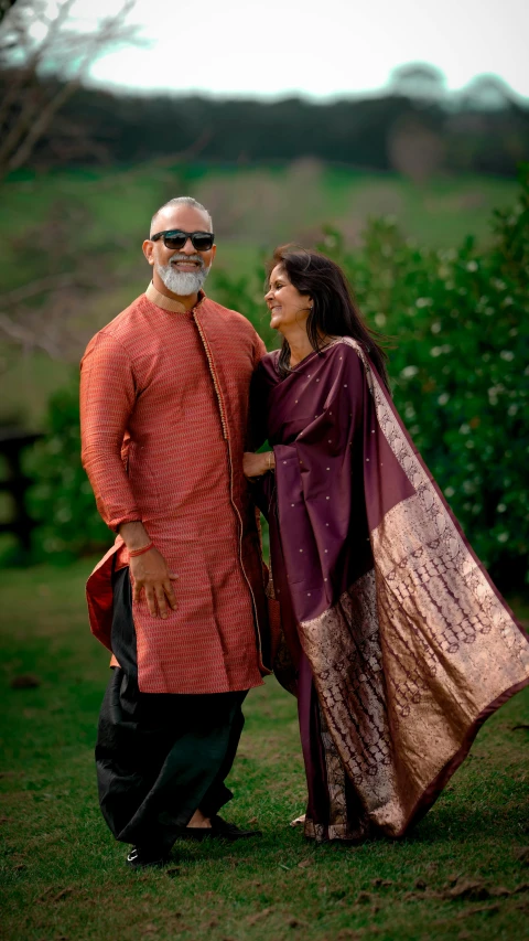 two people are dressed in costumes posing for a po