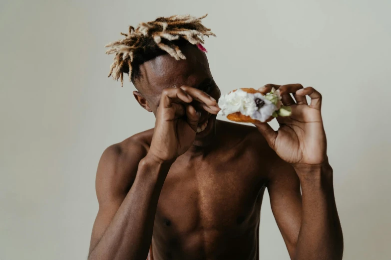 a man eating food while looking at it