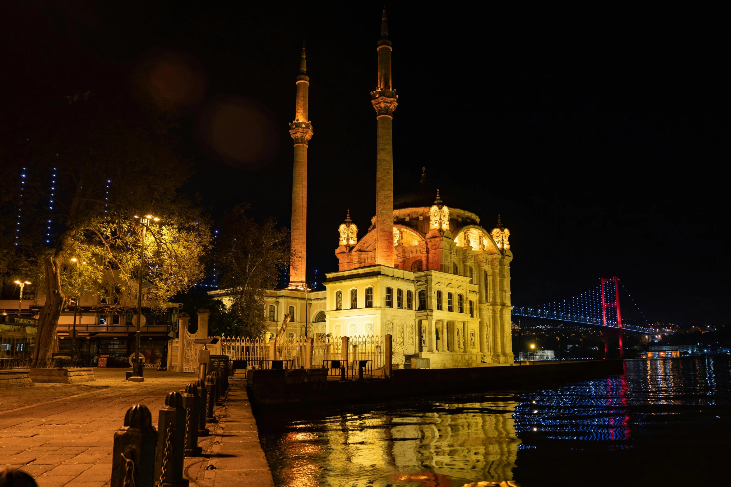 an illuminated building in the dark at night