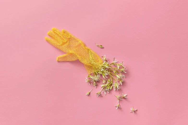 a yellow item sitting on top of a pink surface