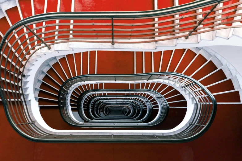 an indoor staircase that looks like a spiral stair