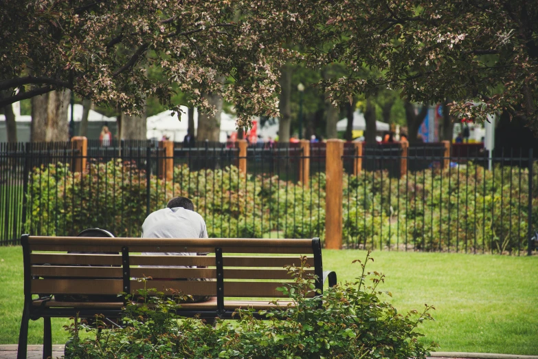 there is a man that is sitting on a bench