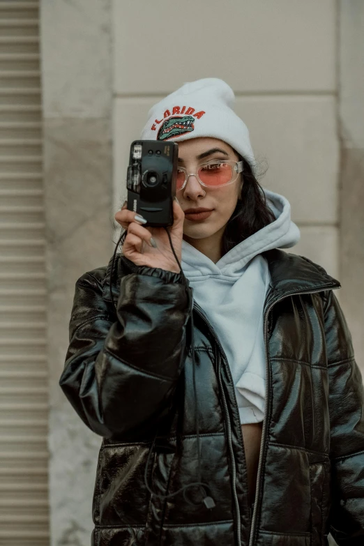 a woman taking a selfie of herself with her camera