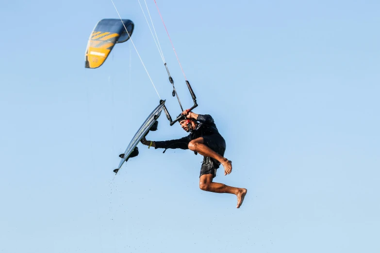 the man is flying in the air on a board