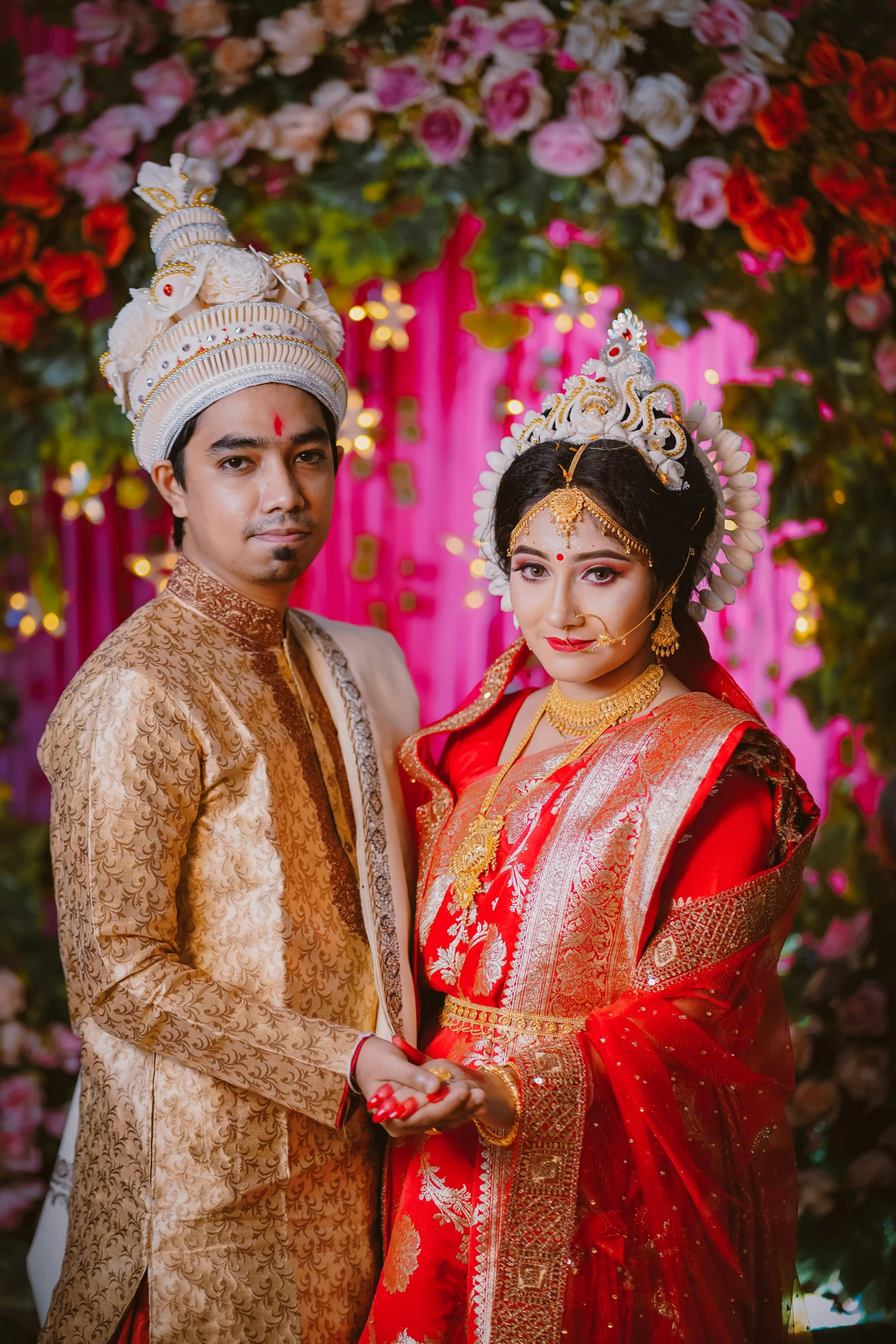 a man and woman posing for a wedding po