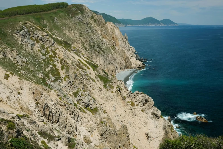 an area of rocks and water along the beach