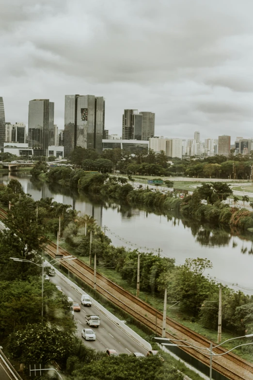 an overhead view of a busy city with water flowing over the highway