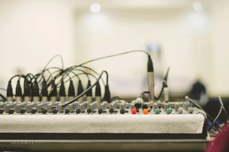 a close up view of a mixing machine and cables