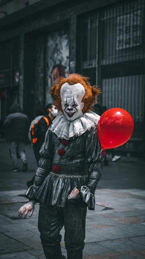 a clown is seen walking down the street