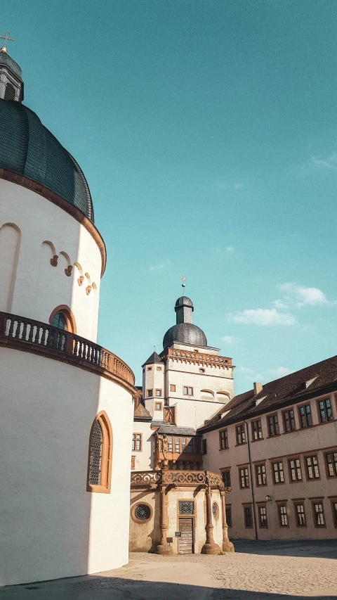 old buildings with a tower and some doors