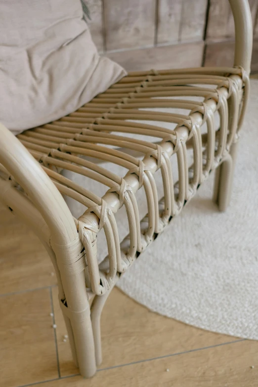 a woven bench that is on the floor