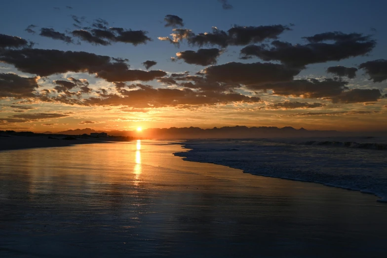 a picture of a sunset on the beach