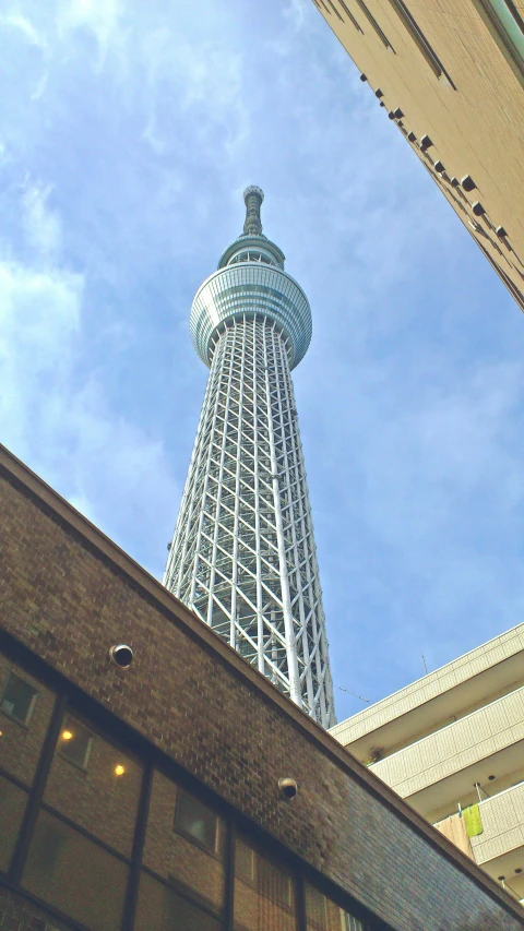 a tall building towering over a city street