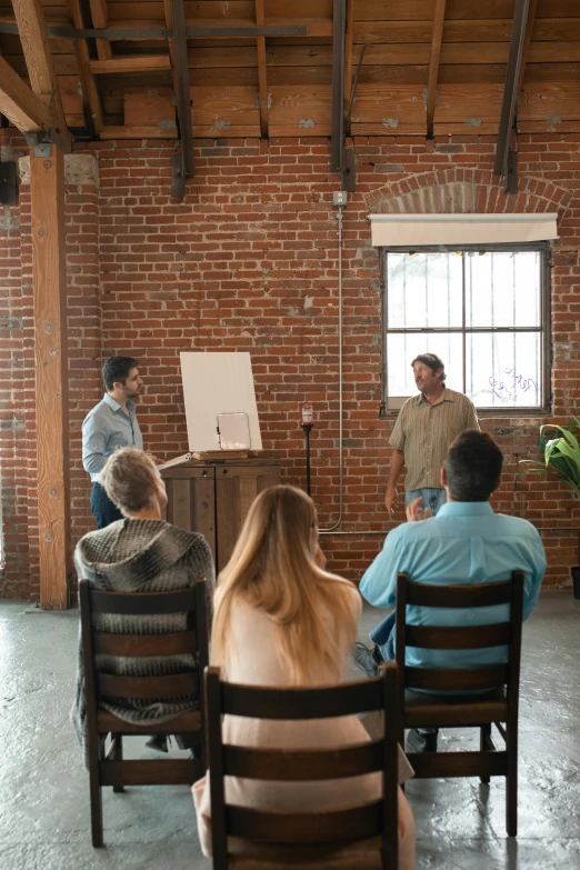 a group of people are gathered in an office