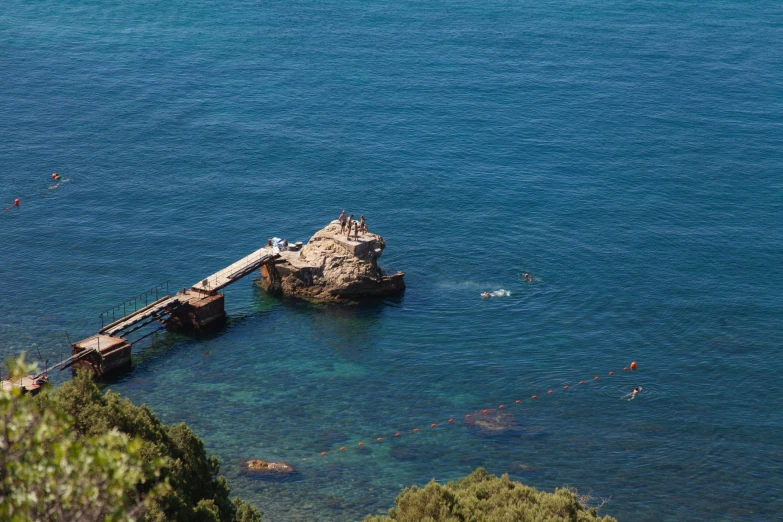 a boat on a body of water near a jetty