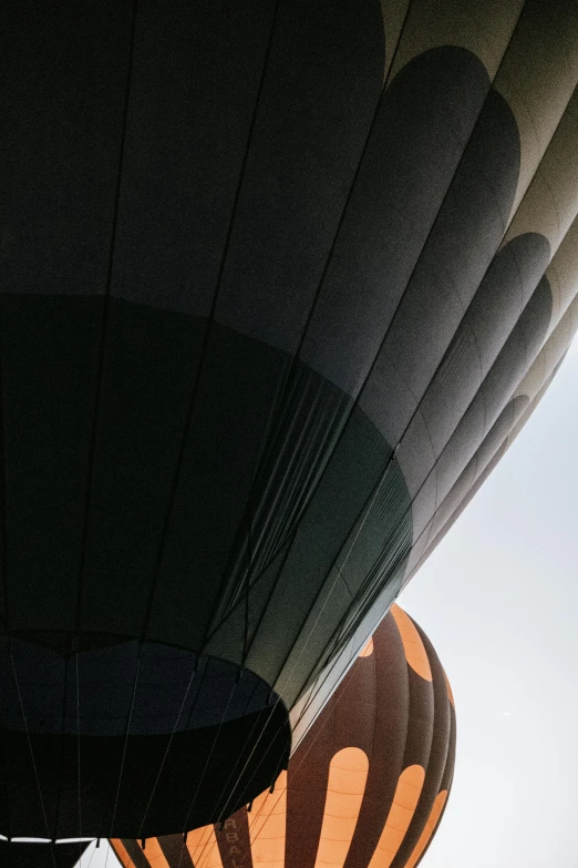 a couple of  air balloons that are flying in the sky