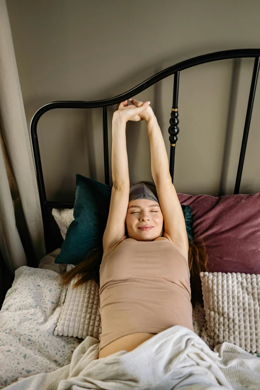 a woman stretching her arms above her head