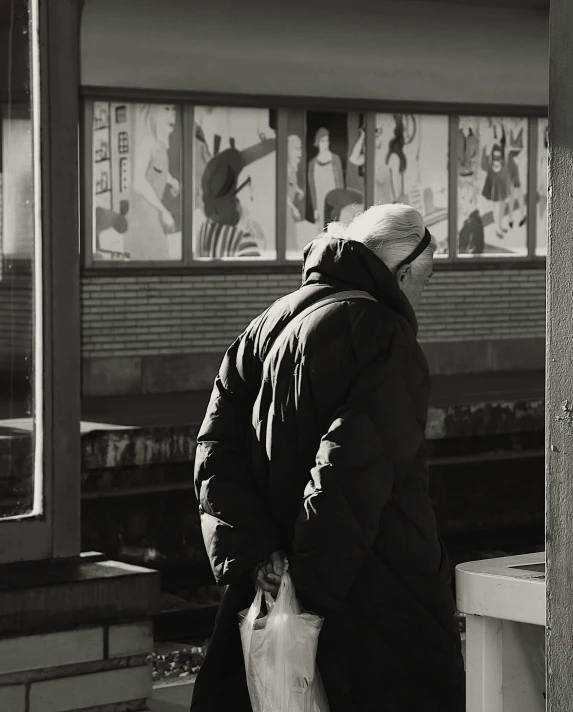 there is a man standing on the train platform