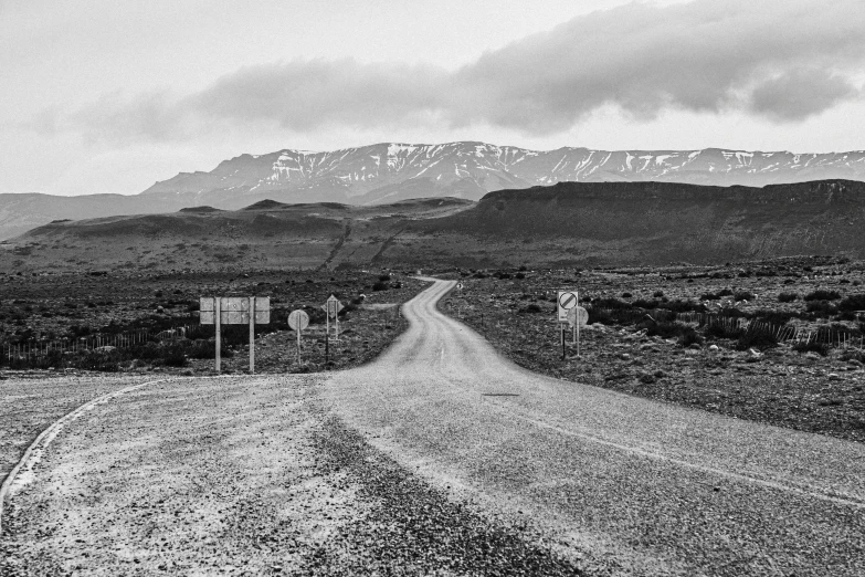 a long lonely road is in the middle of the desert