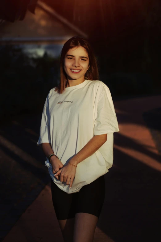 a girl with long hair and a white shirt