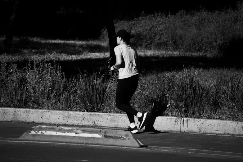 a man on a skateboard that is next to the grass