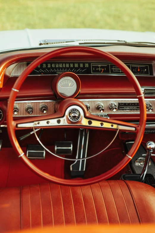 a dashboard of an old style car with gauges on