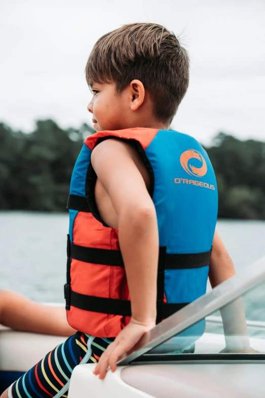 a  paddling his boat to get on the water